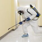 The man are cleaning in room under pest uniform and pest the clean and avoid pest